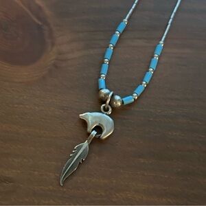 Silver and Blue Beaded Necklace with Feather Pendant